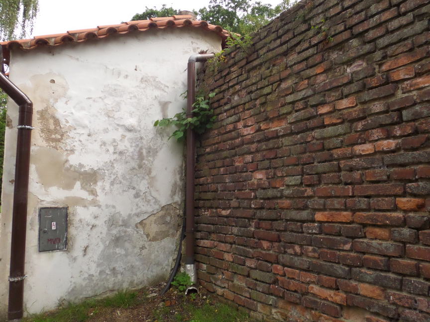 a corner where brick meets plaster