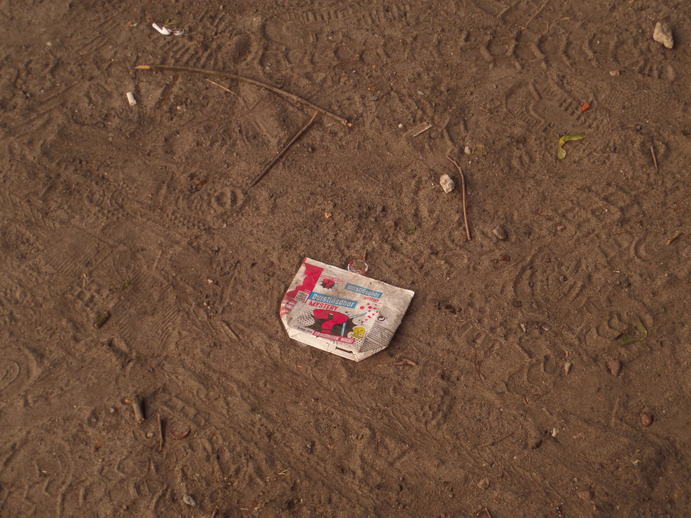 flattened juicebox in the dirt