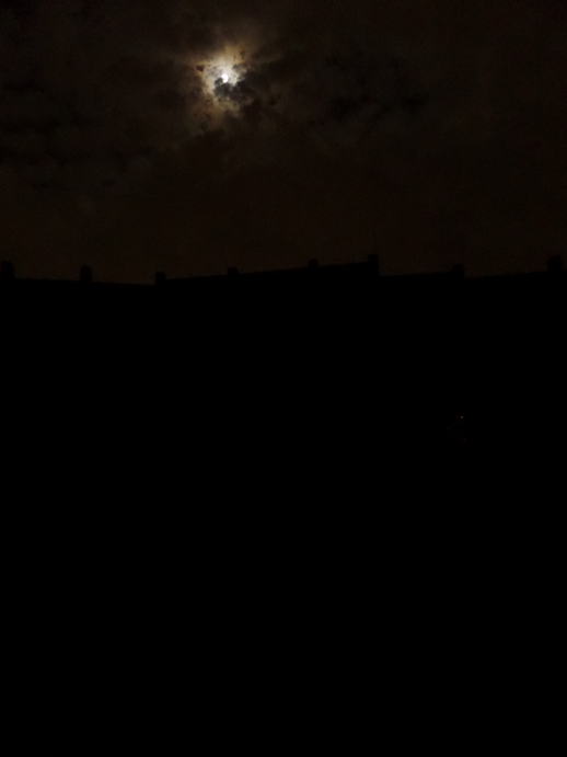 Night time highway wall with the full moon overhead.