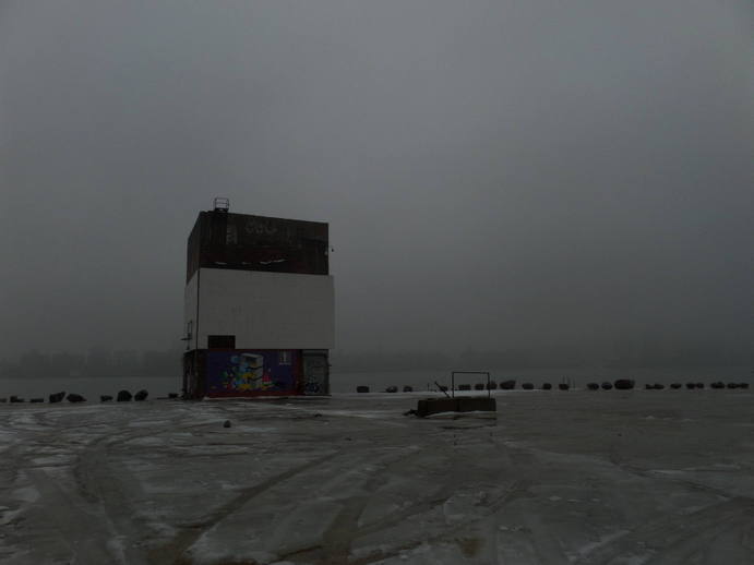 foggy waterfront, a single strange big rectangular building.