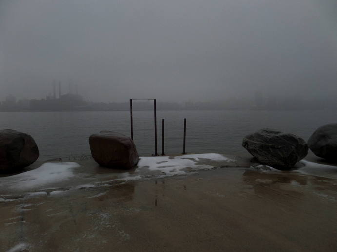 two metal rectangles at the edge of the water.