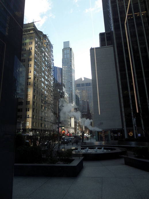 fountain in the foreground, skyscrapers in the background