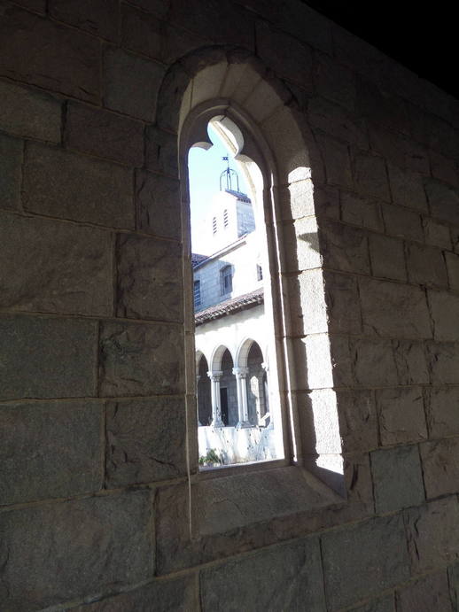 outdoor light coming through a stone window