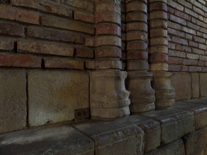 brick columns and a small electrical outlet.