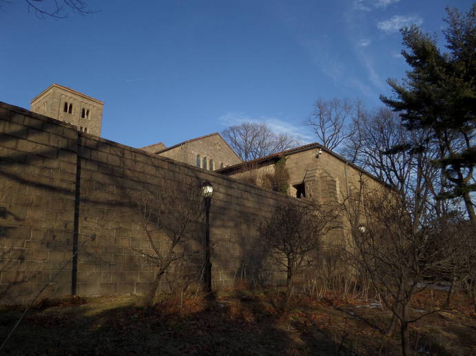 the stone exterior of the cloisters viewed from outside.