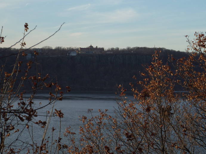 a view across the hudson river to a cliff