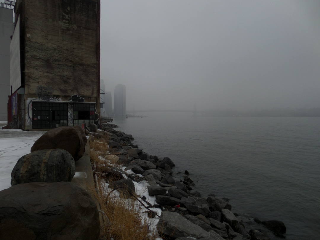 foggy rocky waterfront.