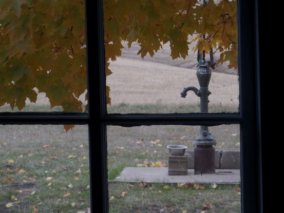 an old water pump out a window